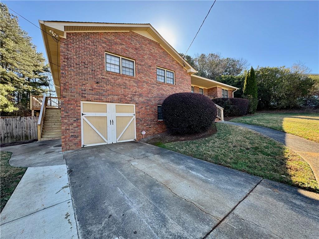 30 Shallowford Road Northeast Kennesaw, GA 30144 - Photo 3 of 41 a view of a house with a yard