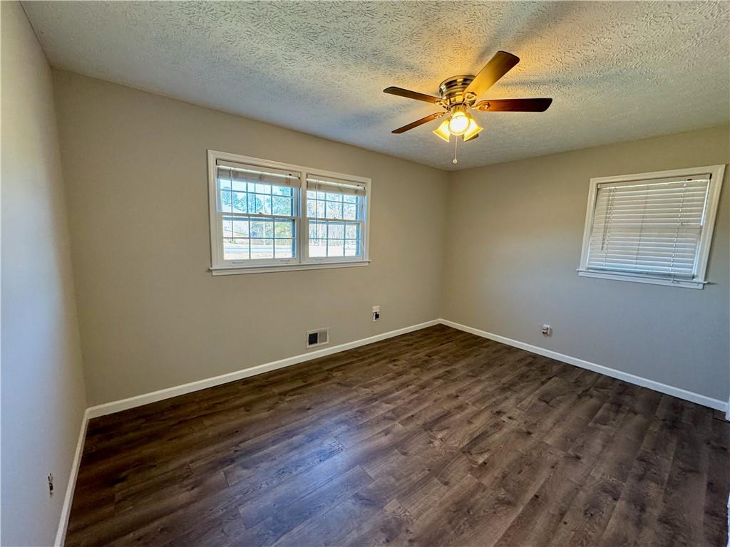 30 Shallowford Road Northeast Kennesaw, GA 30144 - Photo 32 of 41 a view of a livingroom with a ceiling fan and window