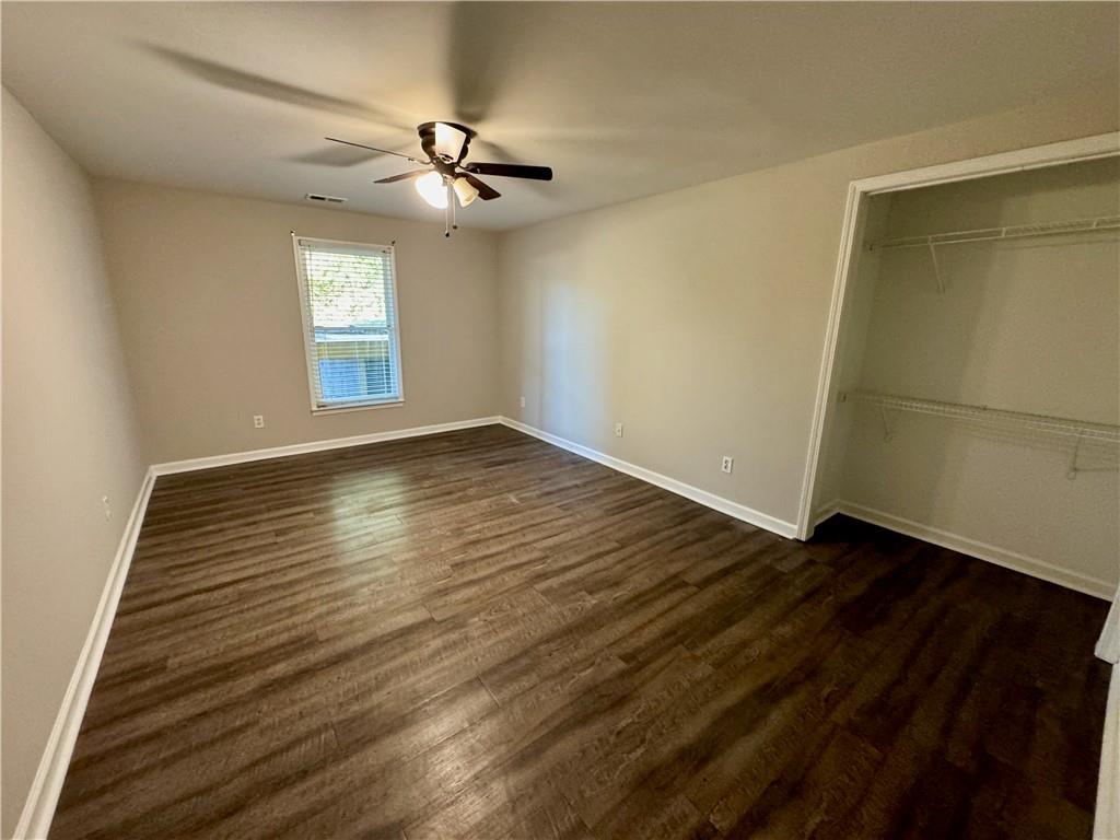 30 Shallowford Road Northeast Kennesaw, GA 30144 - Photo 34 of 41 a view of an empty room with wooden floor and a window