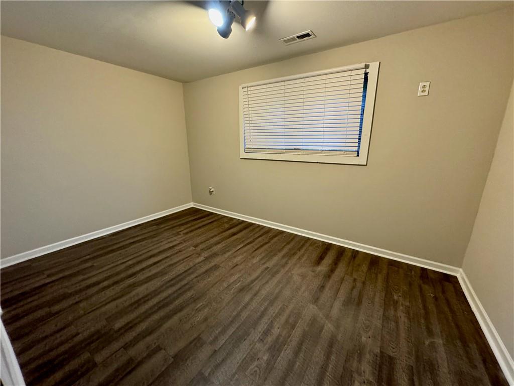 30 Shallowford Road Northeast Kennesaw, GA 30144 - Photo 35 of 41 a view of an empty room with wooden floor and a window