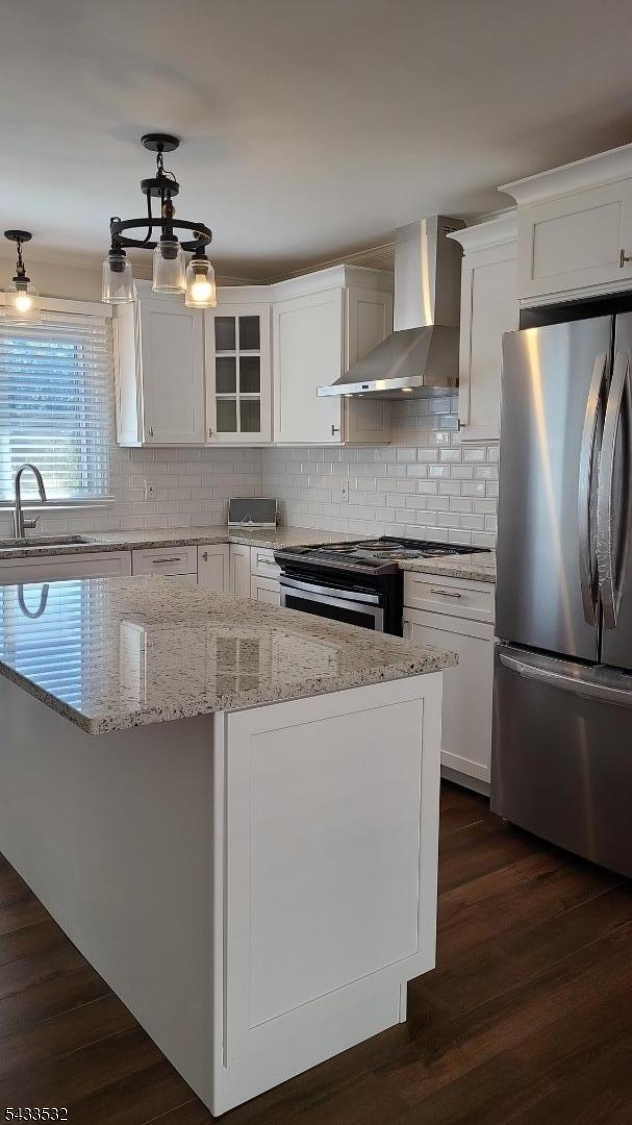 16 Ocean Street Millburn, NJ 07041 - Photo 4 of 26 a kitchen with stainless steel appliances granite countertop a refrigerator a stove and a sink