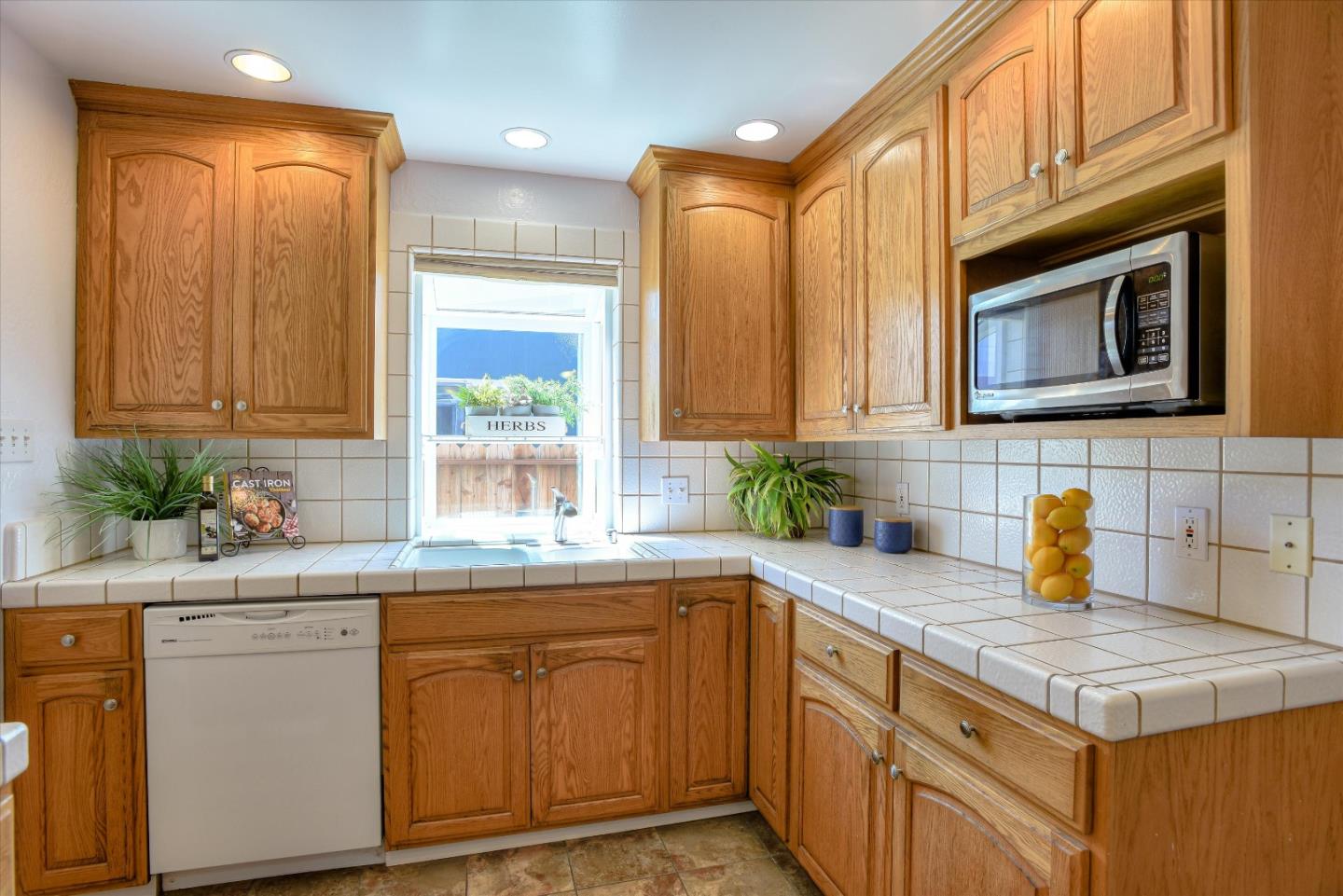 1619 Echo Avenue San Mateo, CA 94401 - Photo 13 of 34 a kitchen with stainless steel appliances granite countertop a sink a stove and cabinets