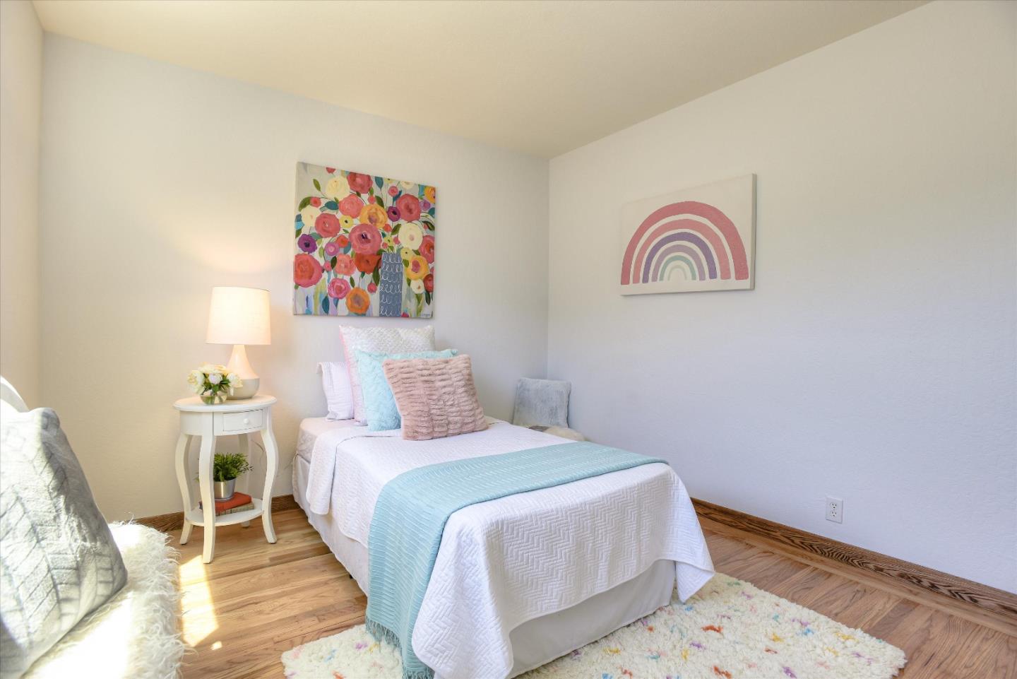 1619 Echo Avenue San Mateo, CA 94401 - Photo 20 of 34 a bedroom with a bed and painting on the wall