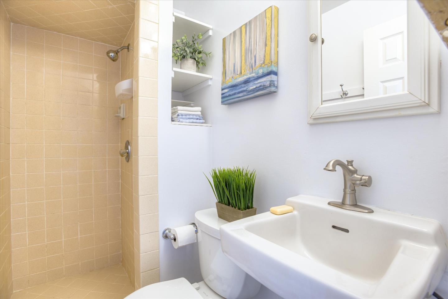 1619 Echo Avenue San Mateo, CA 94401 - Photo 28 of 34 a bathroom with a sink a toilet and a mirror