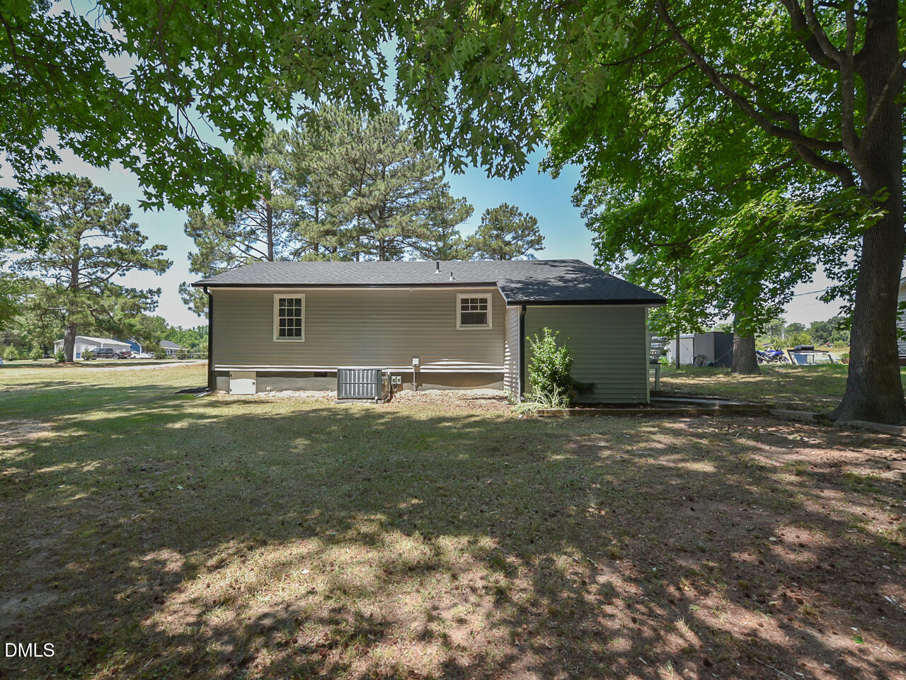 939 Cheves Road Zebulon, NC 27597 - Photo 21 of 21 a view of a house with a yard