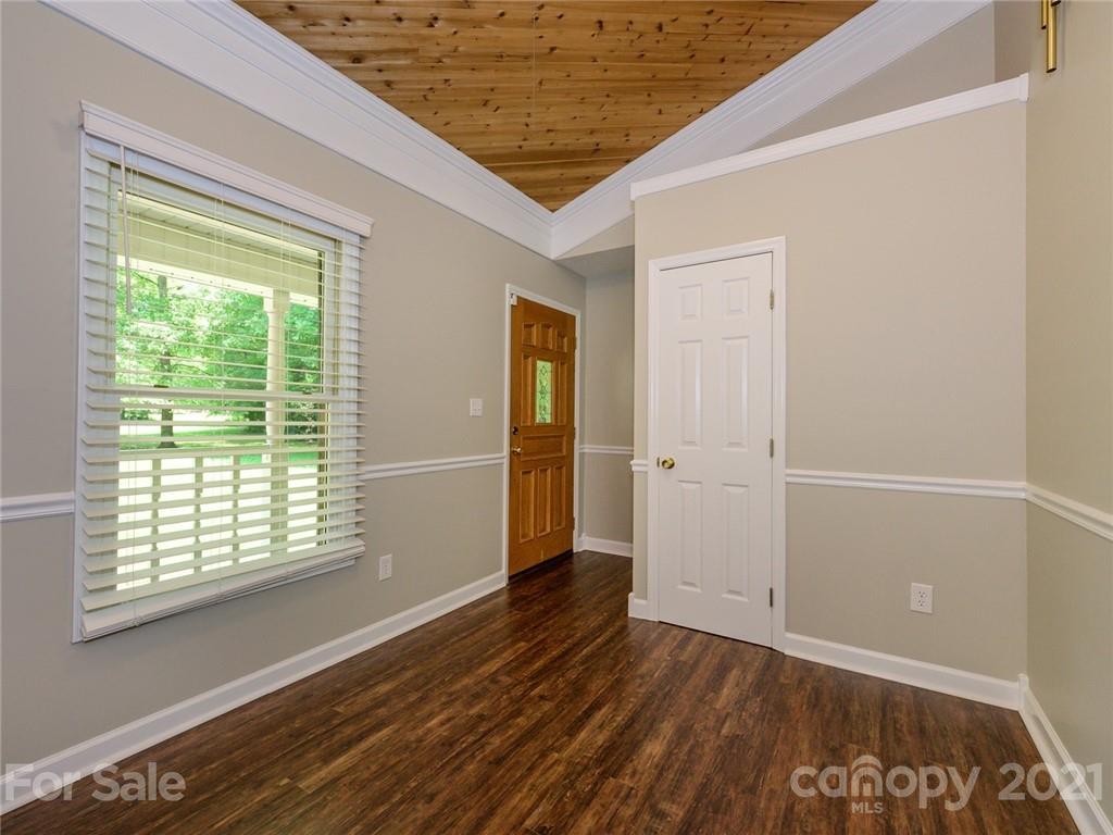 513 West Rebound Road Lancaster, SC 29720 - Photo 2 of 31 a view of an empty room with wooden floor and a window