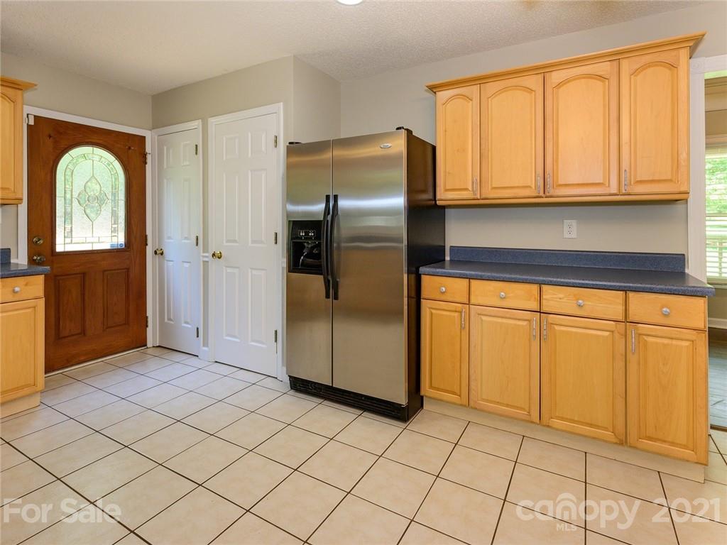 513 West Rebound Road Lancaster, SC 29720 - Photo 12 of 31 a kitchen with stainless steel appliances granite countertop a refrigerator a stove and a sink with cabinets