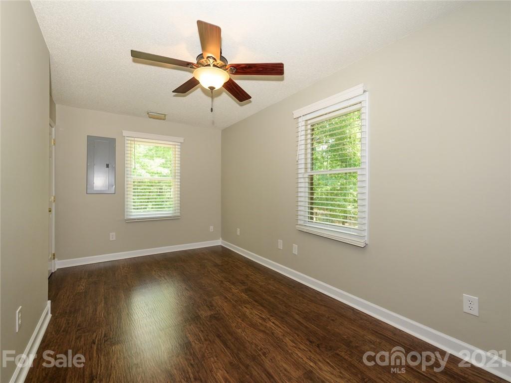 513 West Rebound Road Lancaster, SC 29720 - Photo 15 of 31 a view of an empty room with wooden floor and a window