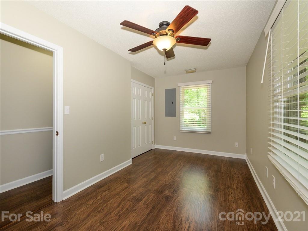 513 West Rebound Road Lancaster, SC 29720 - Photo 16 of 31 an empty room with wooden floor fan and windows