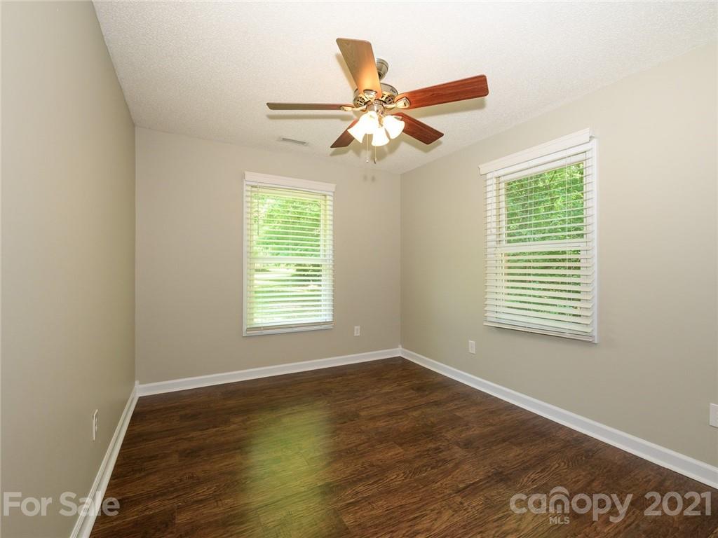 513 West Rebound Road Lancaster, SC 29720 - Photo 20 of 31 a view of an empty room with wooden floor and a window