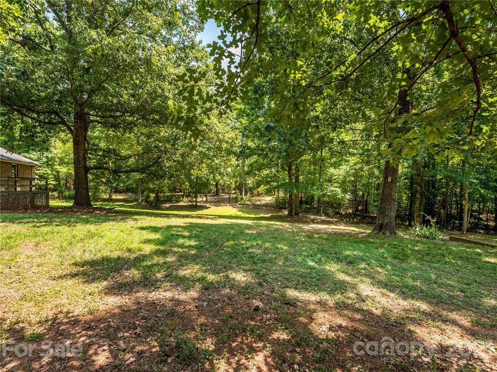 513 West Rebound Road Lancaster, SC 29720 - Photo 25 of 31 a view of outdoor space with deck and trees