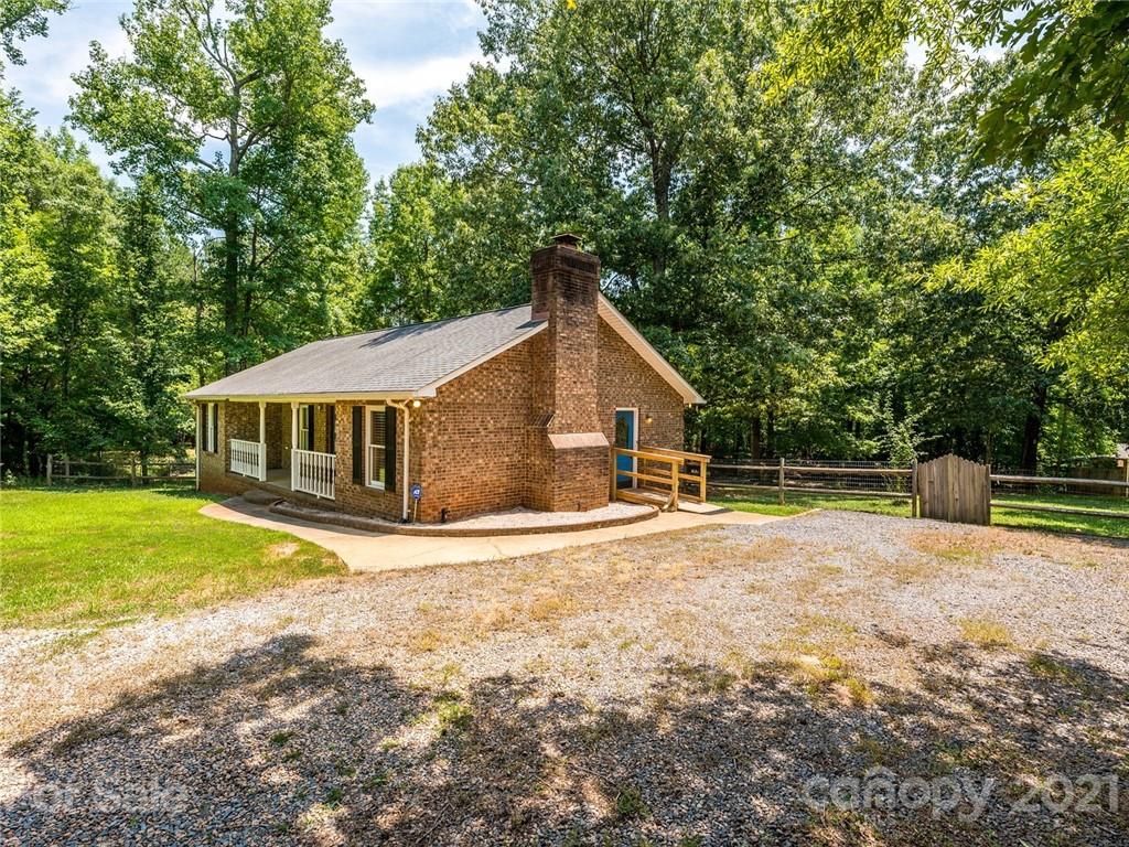 513 West Rebound Road Lancaster, SC 29720 - Photo 31 of 31 a front view of a house with a yard and trees