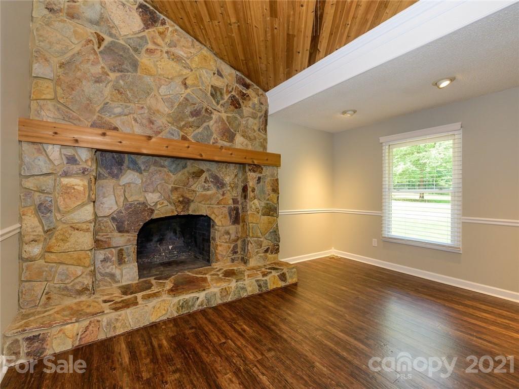 513 West Rebound Road Lancaster, SC 29720 - Photo 5 of 31 a view of empty room with wooden floor and fireplace