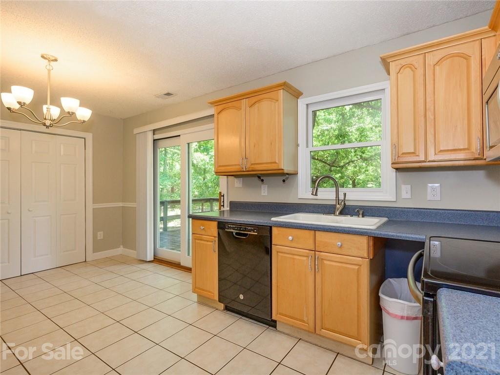 513 West Rebound Road Lancaster, SC 29720 - Photo 10 of 31 a kitchen with a window a sink and a counter space