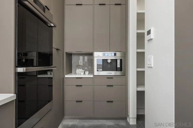 a view of storage and utility room with empty racks