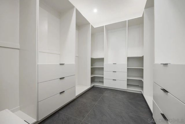 an aerial view of residential houses with city view