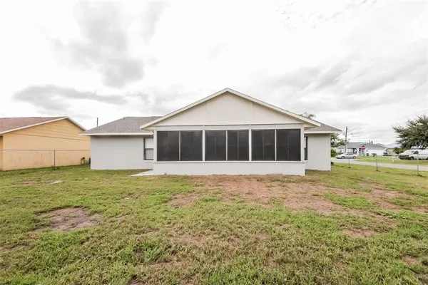 a view of a house with a yard