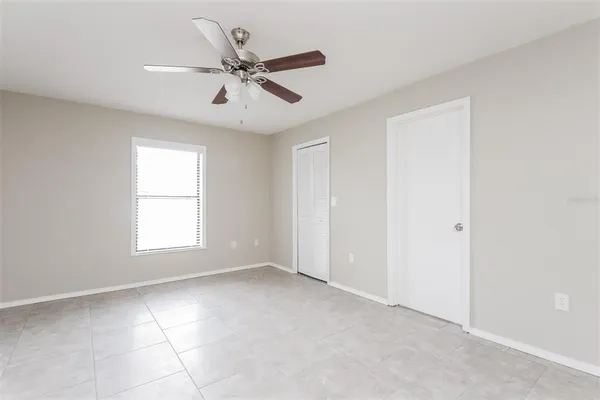 a view of an empty room with a window