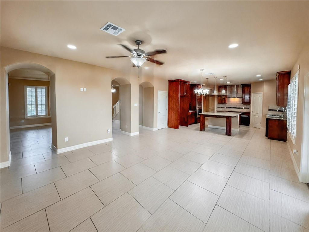 1832 Bay Landing Drive Portland, TX 78374 - Photo 14 of 29 a view of a kitchen with furniture and a ceiling fan