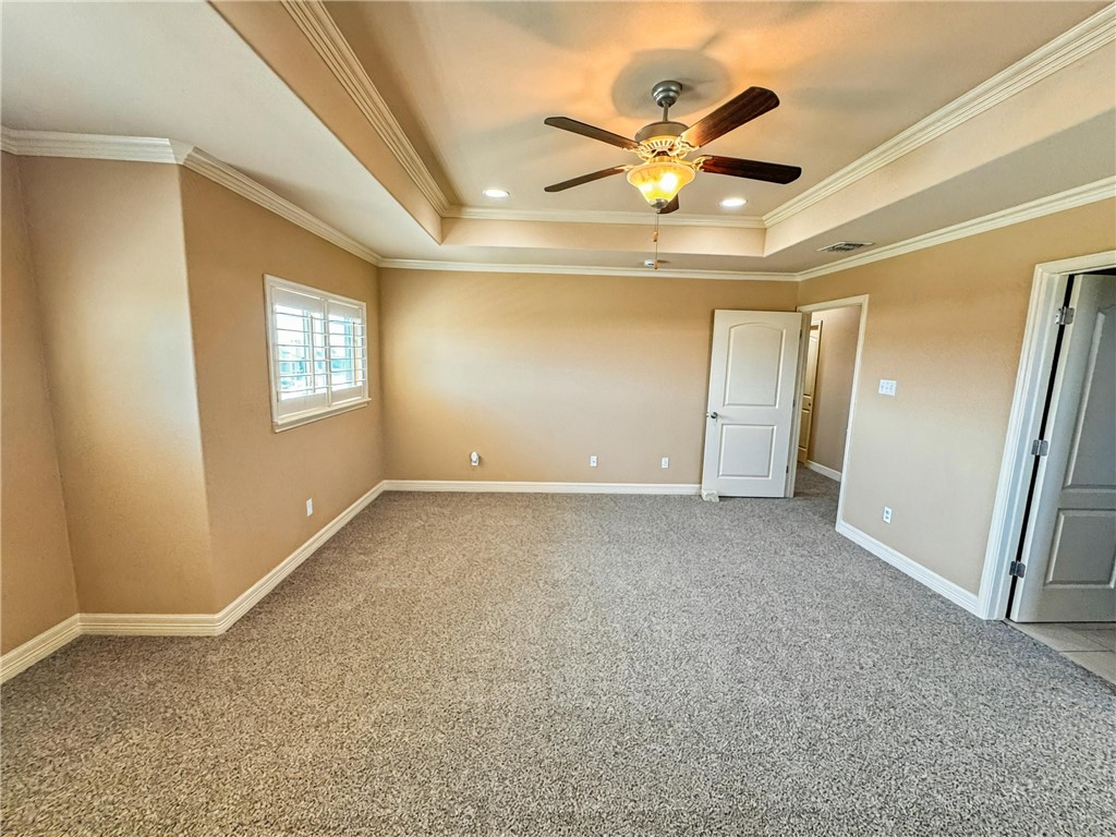 1832 Bay Landing Drive Portland, TX 78374 - Photo 21 of 29 an empty room with a ceiling fan and window