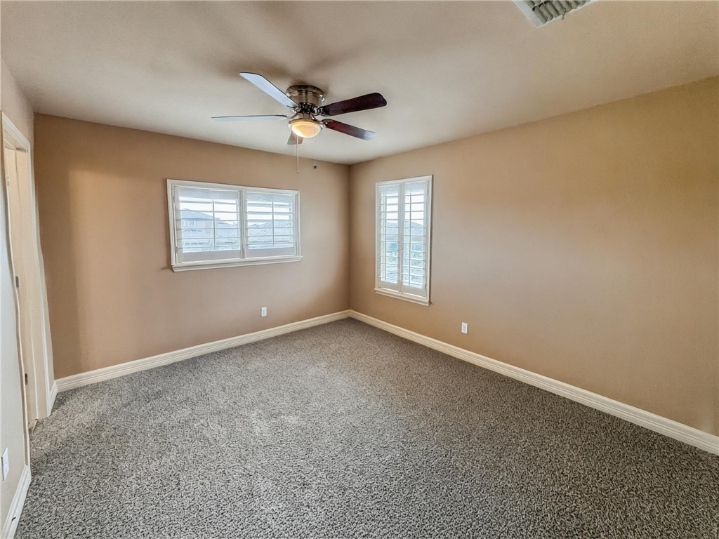 1832 Bay Landing Drive Portland, TX 78374 - Photo 29 of 29 an empty room with windows and fan