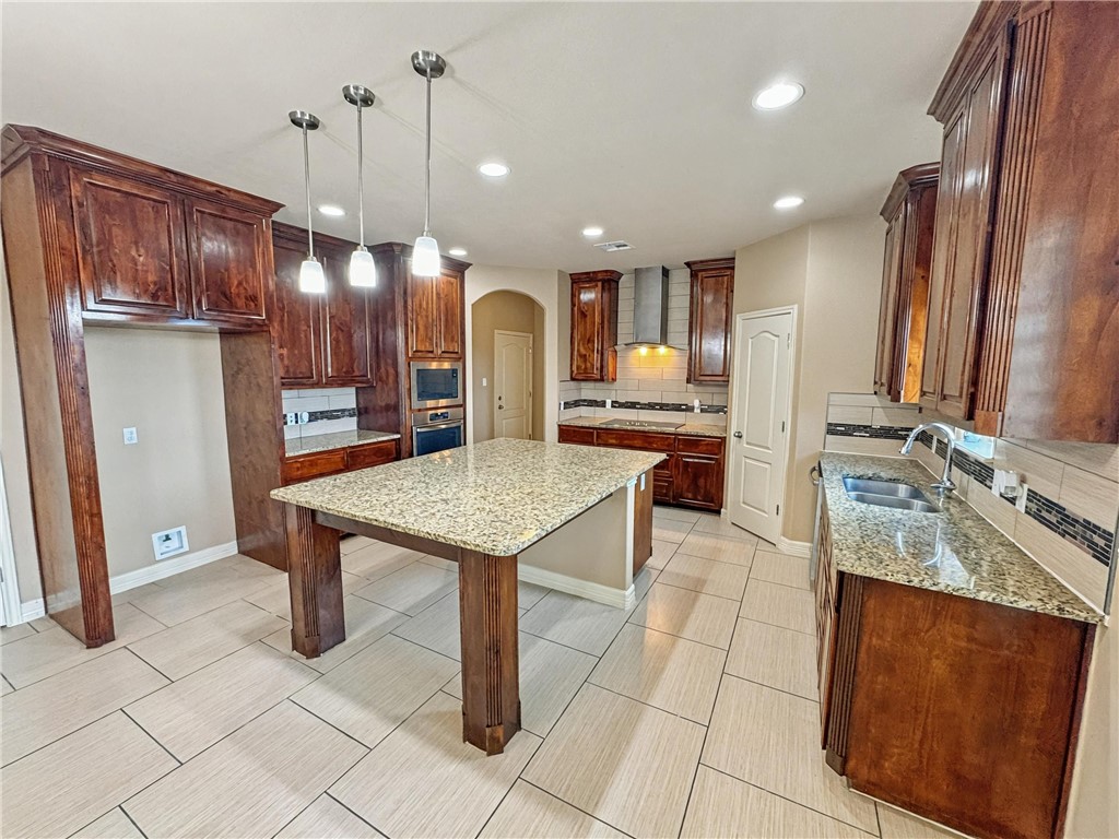 1832 Bay Landing Drive Portland, TX 78374 - Photo 8 of 29 a large kitchen with a table and chairs