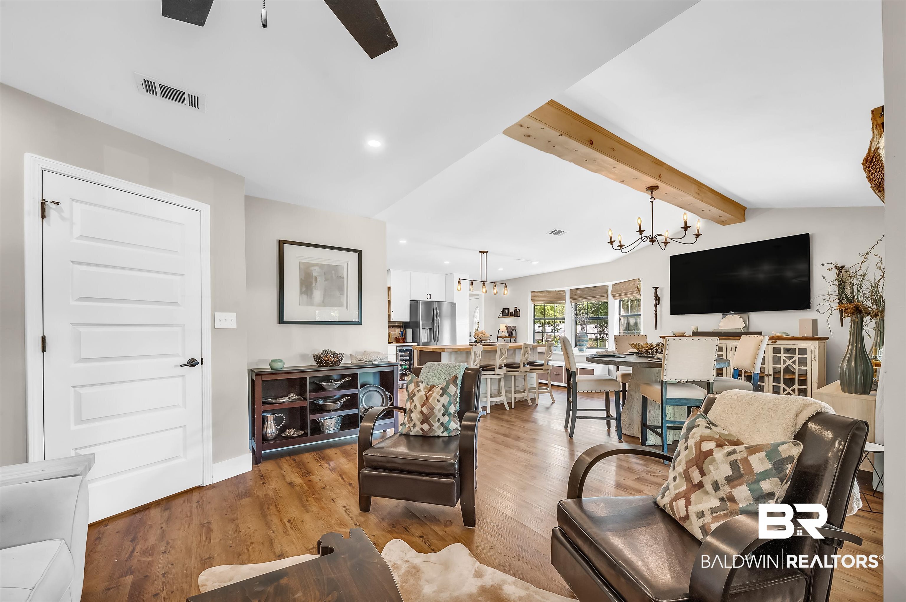 5215 Pine Road Orange Beach, AL 36561 - Photo 14 of 60 Living room featuring a chandelier, beamed ceiling, recessed lighting, ceiling fan, and light wood finished floors