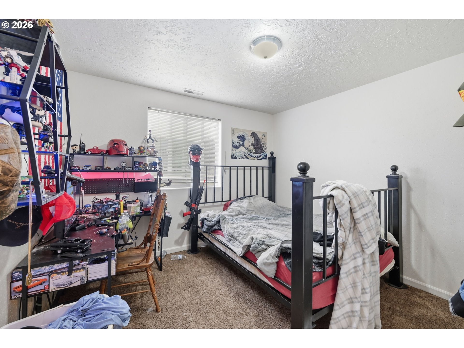 87851 Cedar Flat Road Springfield, OR 97478 - Photo 11 of 23 a bed room with two beds and a desk