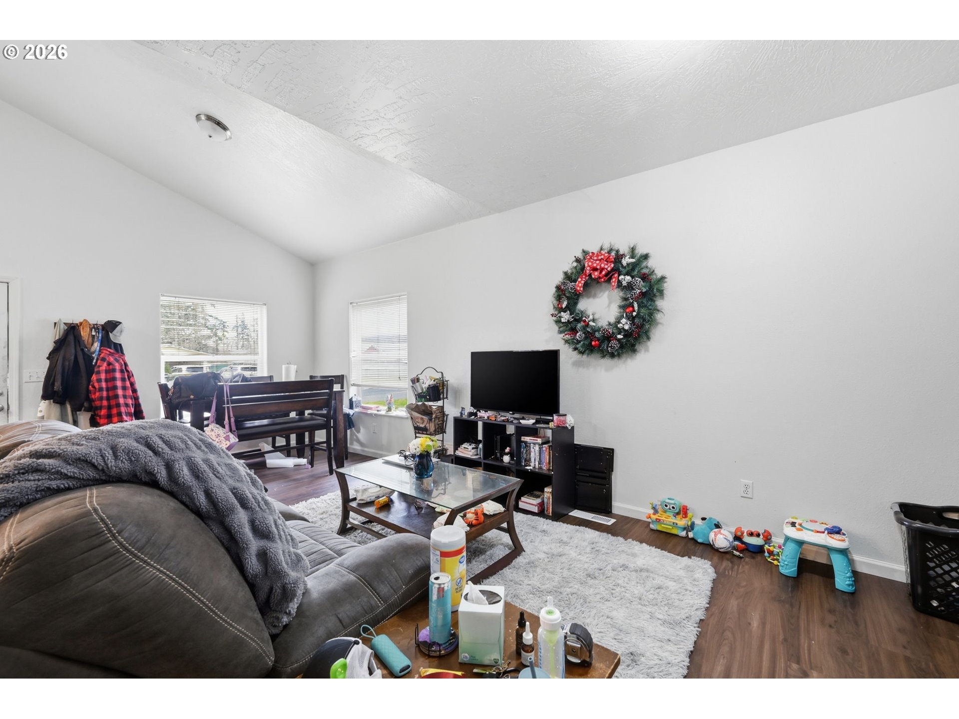 87851 Cedar Flat Road Springfield, OR 97478 - Photo 6 of 23 a living room with furniture and a flat screen tv