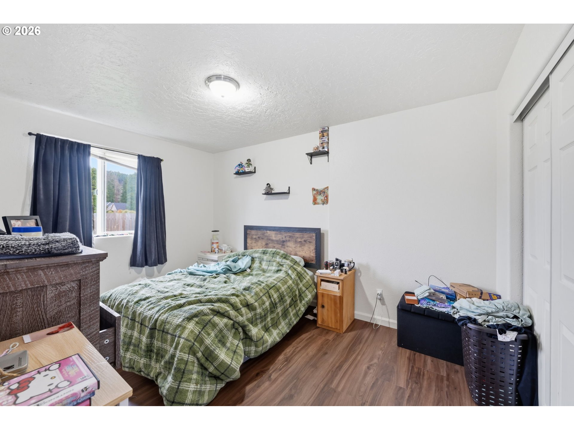 87851 Cedar Flat Road Springfield, OR 97478 - Photo 10 of 23 a bedroom with a bed window and a dresser
