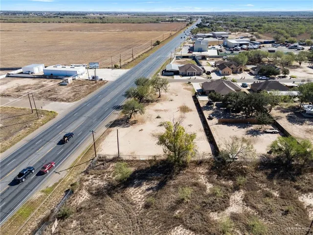 an aerial view of a residential houses with outdoor space