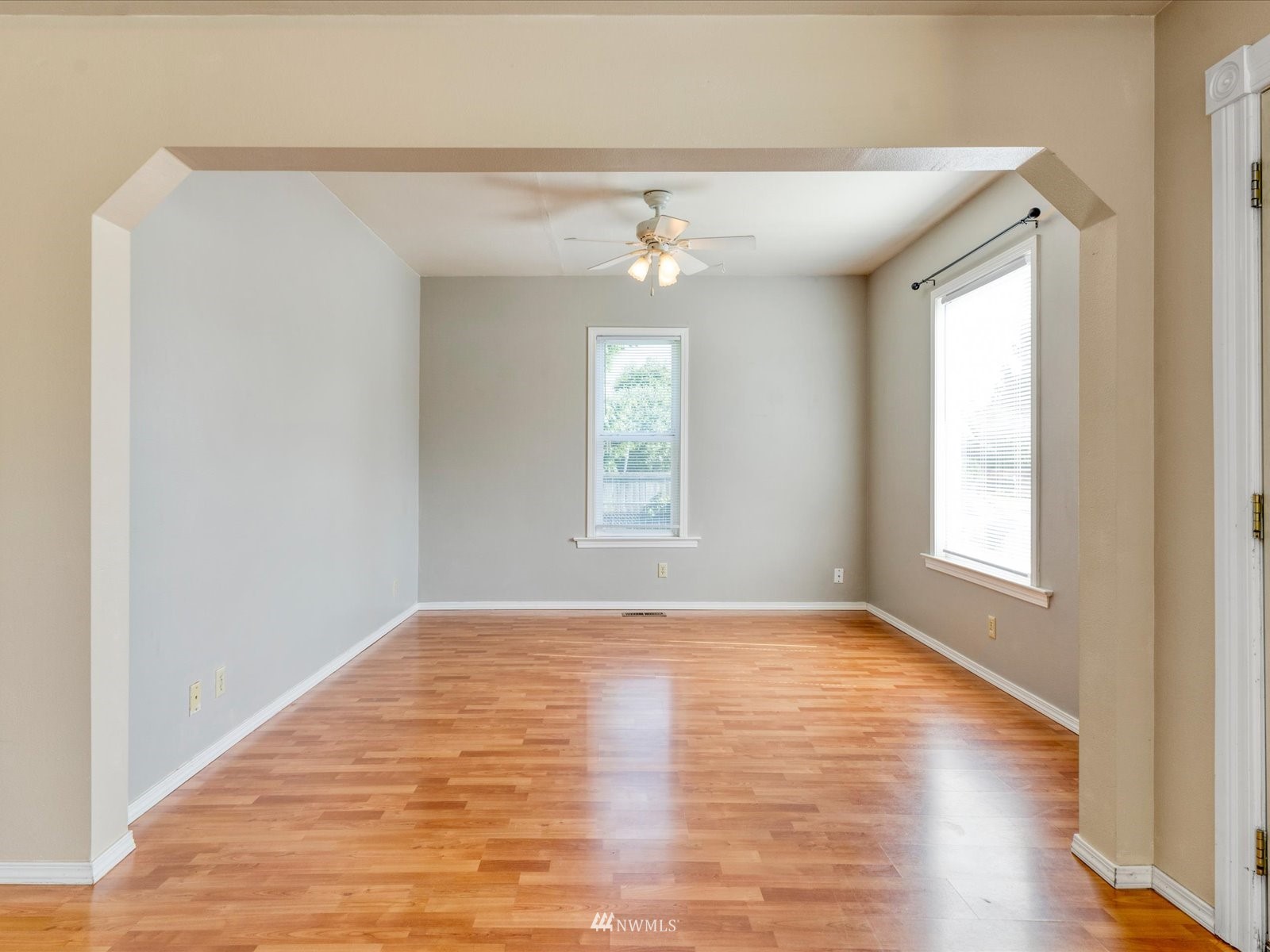 97 Logan Avenue South Renton, WA 98057 - Photo 8 of 32 a view of empty room with wooden floor and fan