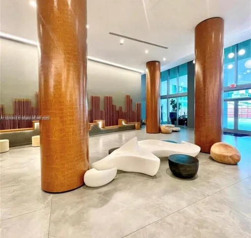 a bathroom with a tub sink and shower