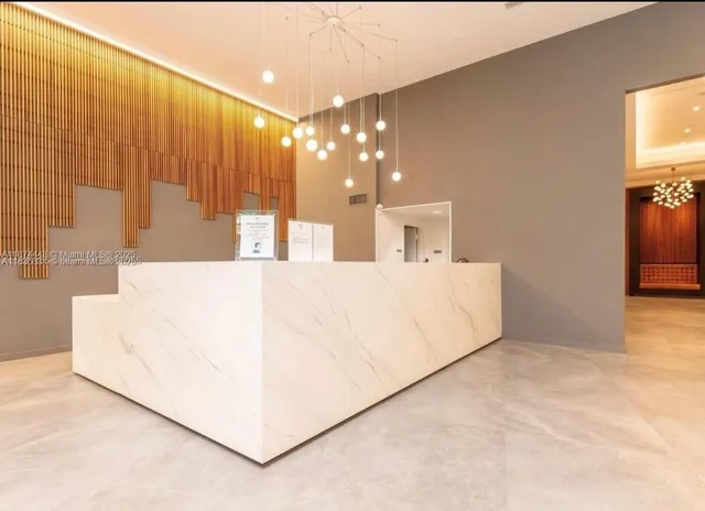 a view of a livingroom with furniture and a ceiling fan