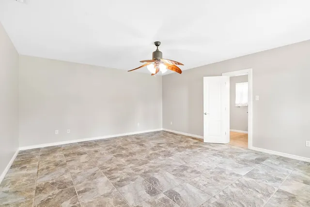 a very nice looking room with a ceiling fan