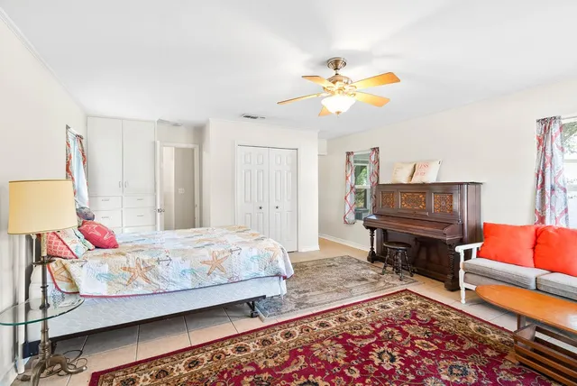 a bedroom with a bed and a couch