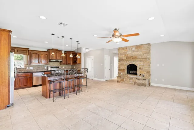 a view of a kitchen with furniture and a kitchen