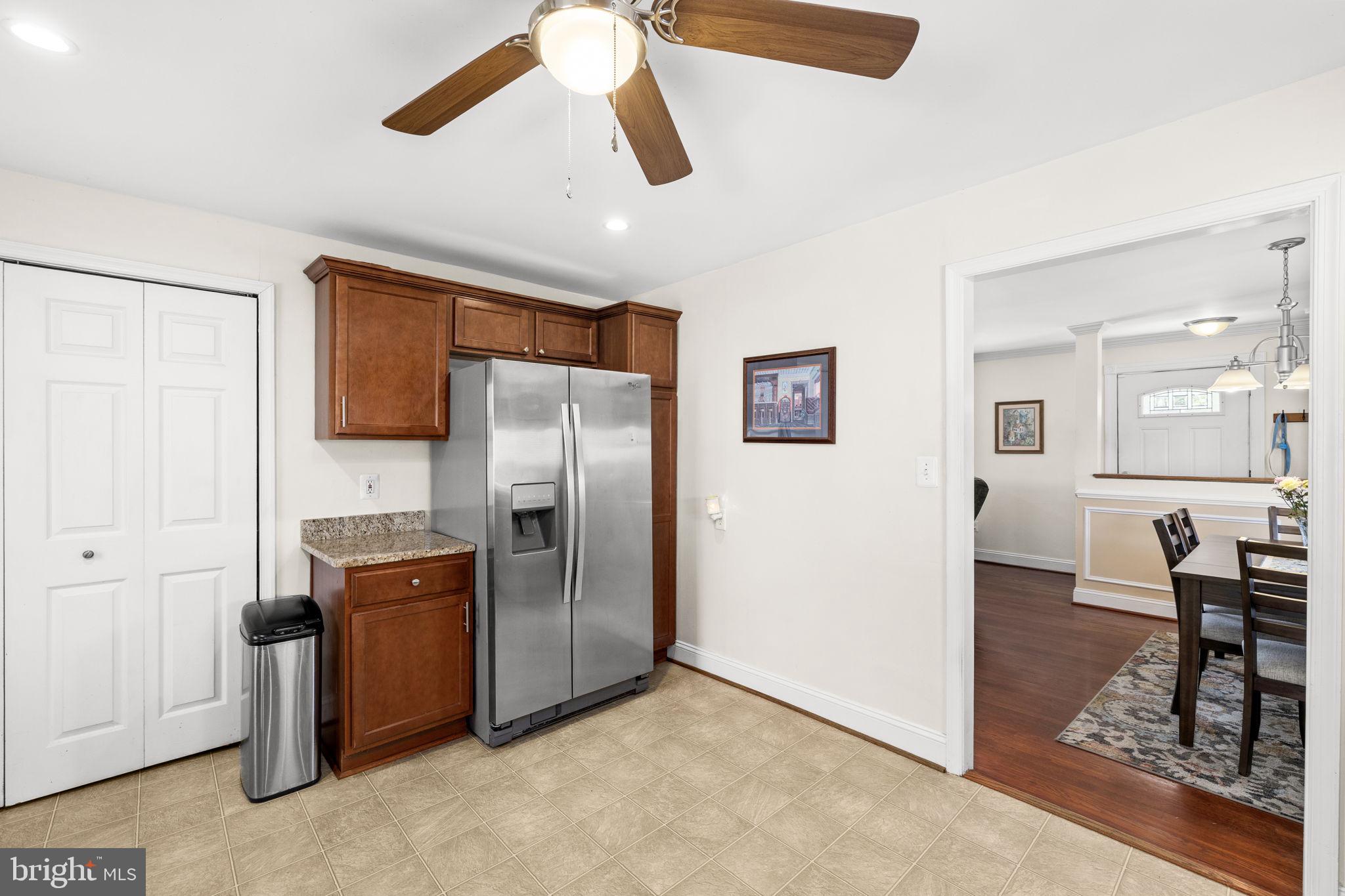 66 Kelley Road Fredericksburg, VA 22405 - Photo 13 of 35 a kitchen with stainless steel appliances granite countertop a refrigerator and a stove top oven