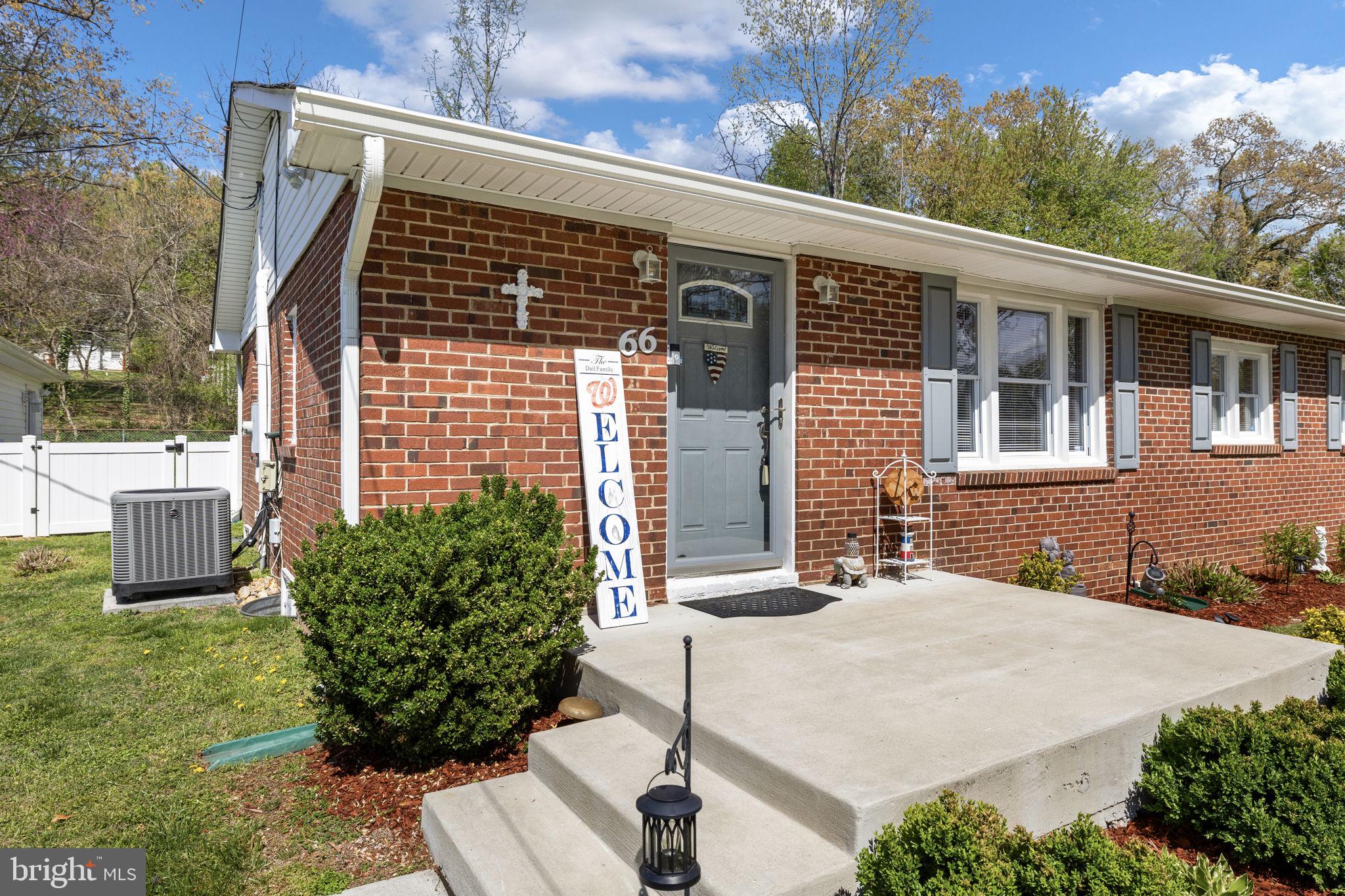 66 Kelley Road Fredericksburg, VA 22405 - Photo 2 of 35 a front view of a house with garden