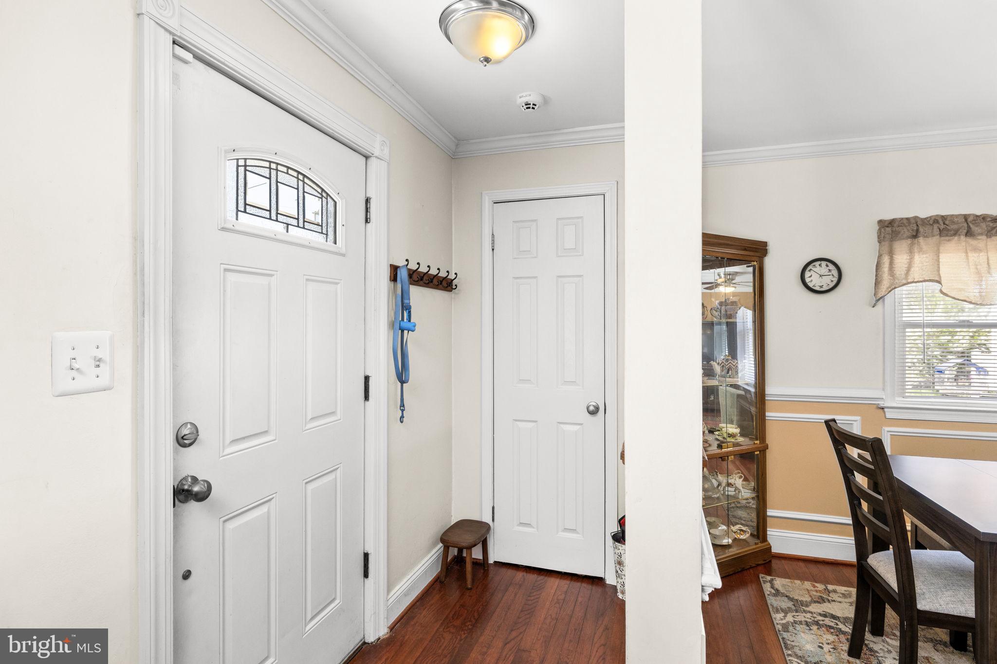 66 Kelley Road Fredericksburg, VA 22405 - Photo 3 of 35 a view of a hallway with wooden floor and furniture