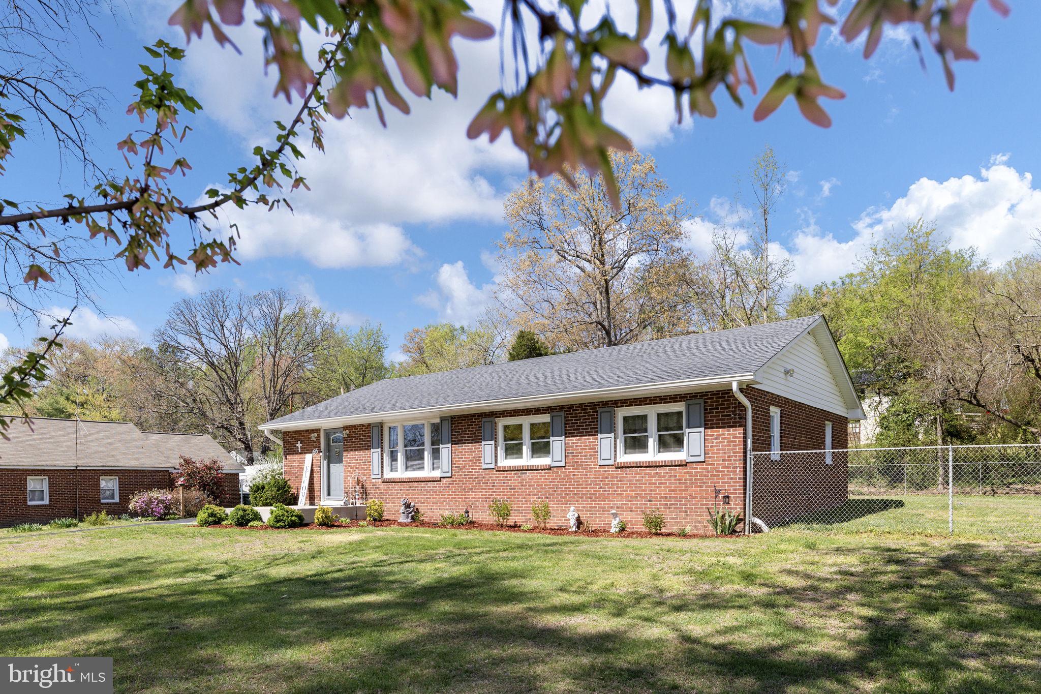 66 Kelley Road Fredericksburg, VA 22405 - Photo 33 of 35 a front view of a house with a garden