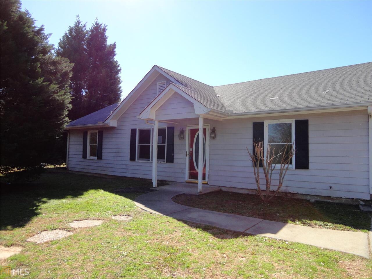57 Mobley Road Griffin, GA 30223 - Photo 1 of 1 a front view of a house with a yard