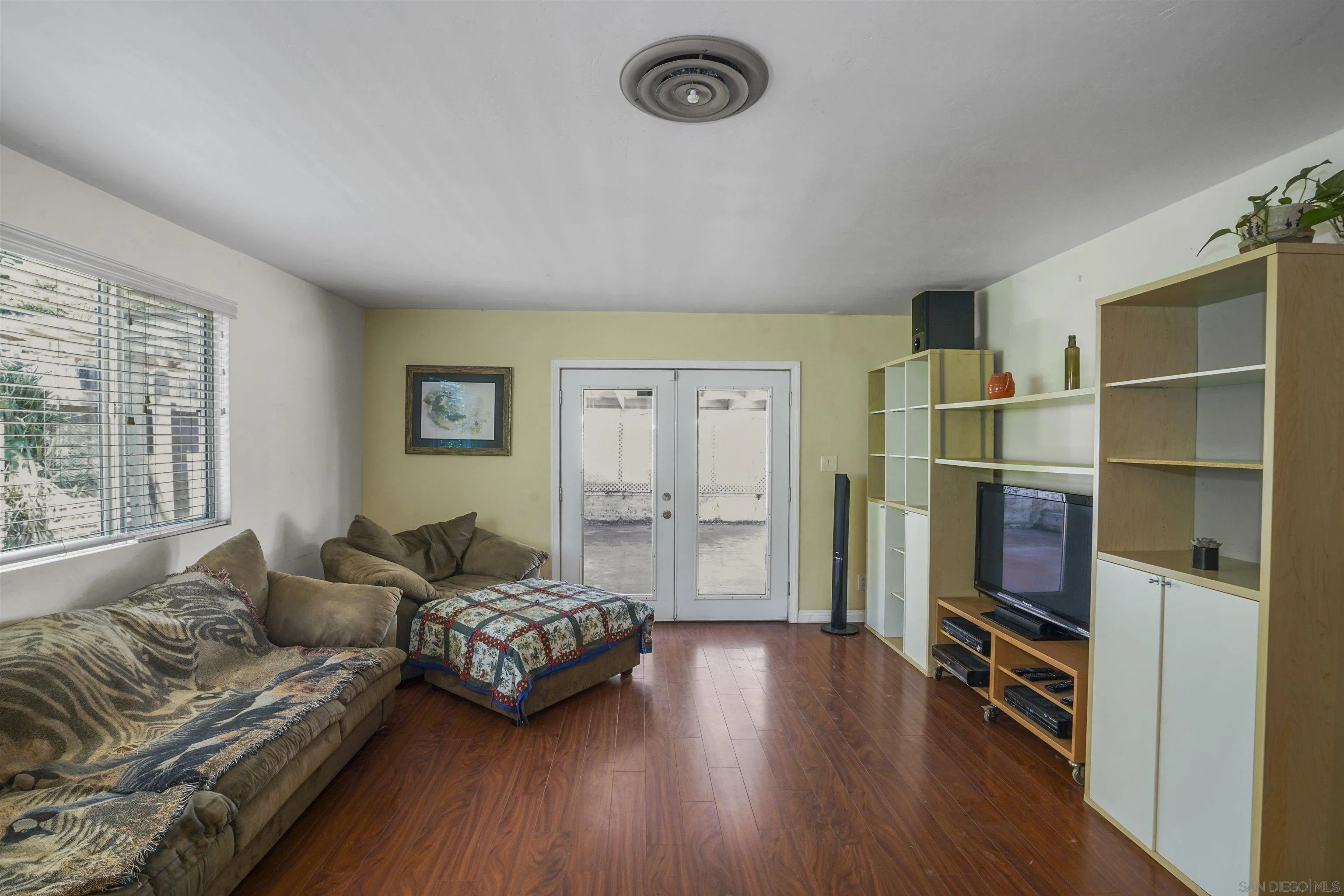 5785 Jackson Drive La Mesa, CA 91942 - Photo 11 of 20 a living room with furniture and a gate