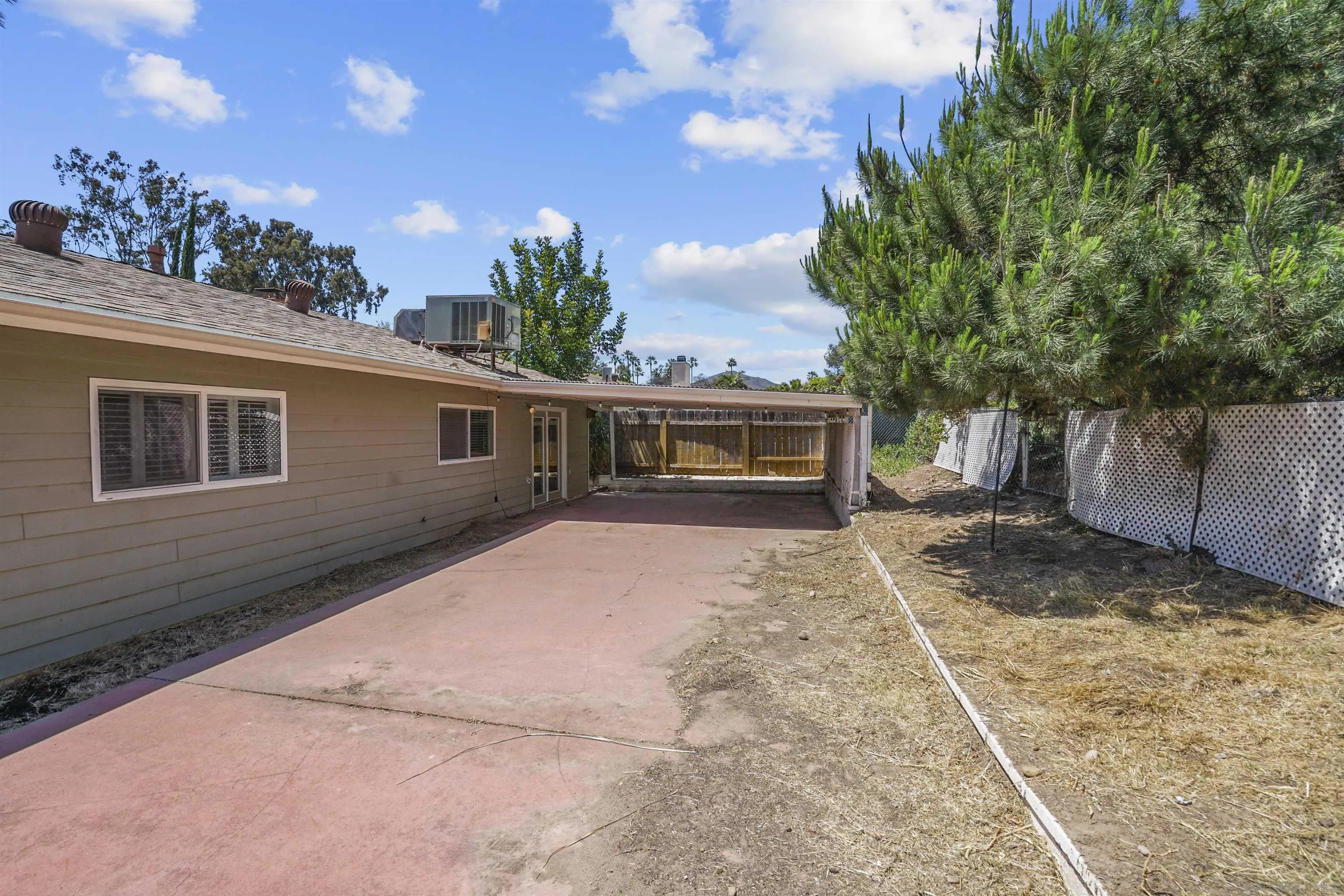 5785 Jackson Drive La Mesa, CA 91942 - Photo 16 of 20 a front view of a house with garden