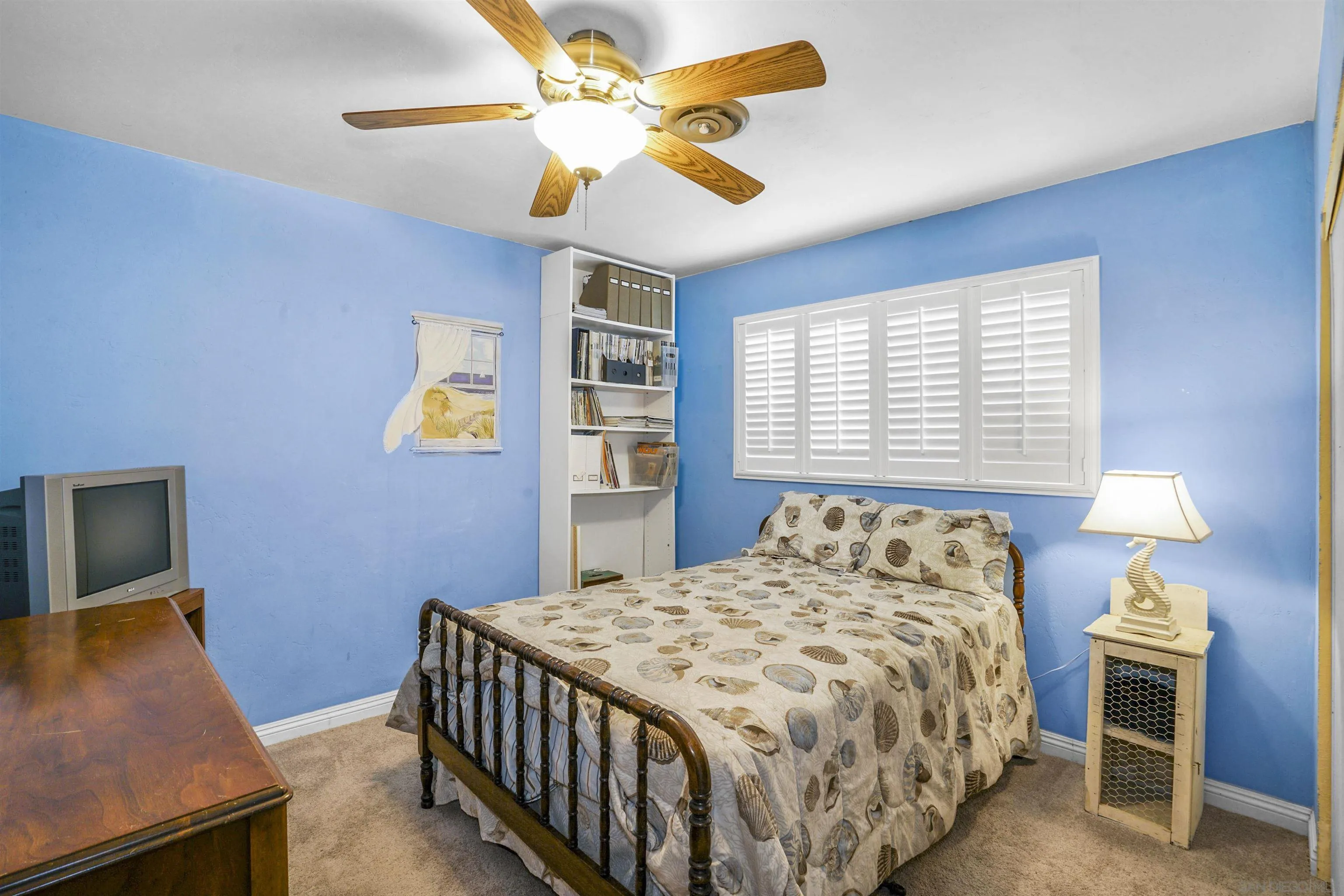 5785 Jackson Drive La Mesa, CA 91942 - Photo 5 of 20 a bedroom with a bed and a chandelier