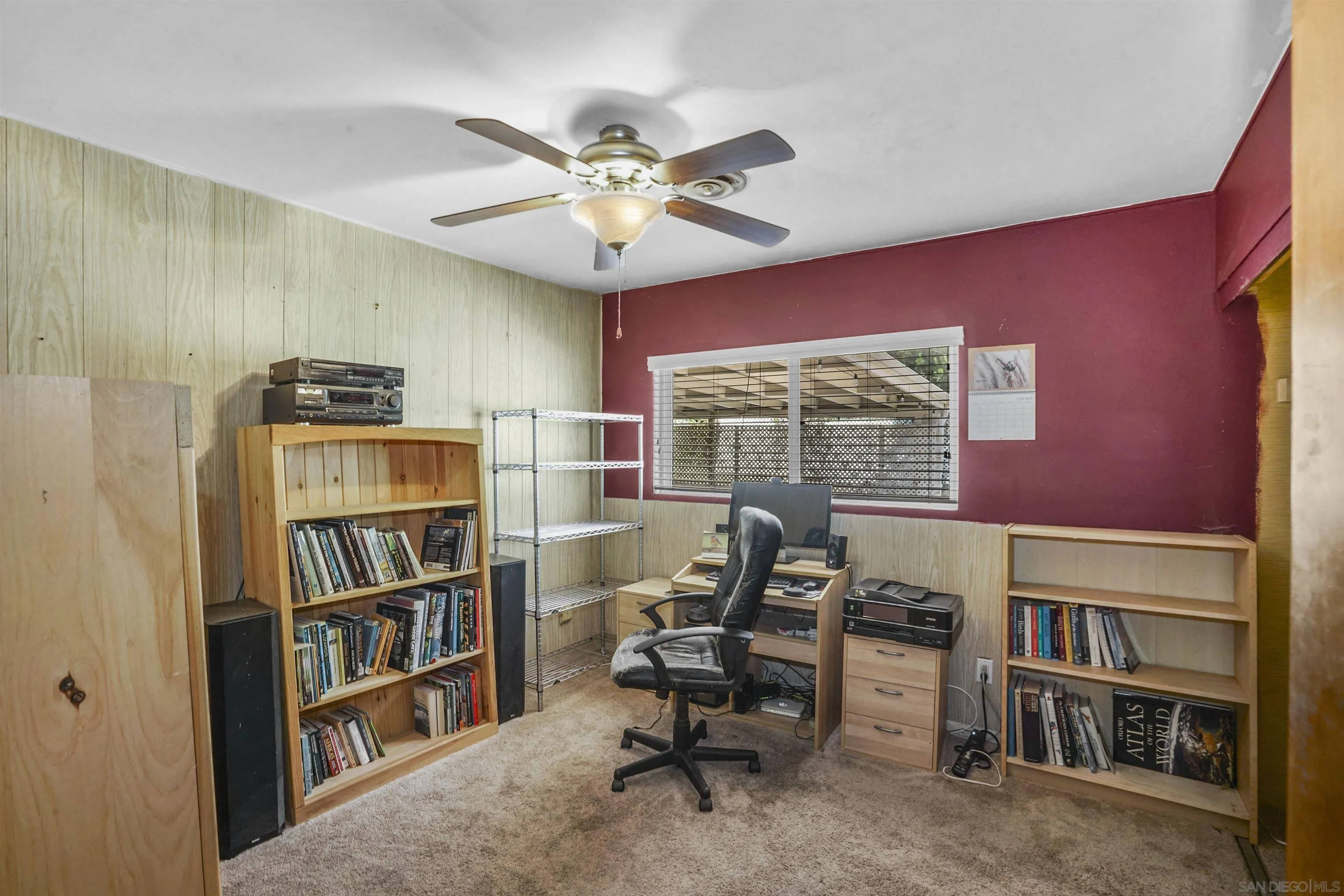 5785 Jackson Drive La Mesa, CA 91942 - Photo 7 of 20 a view of a workspace with furniture and a bookshelf