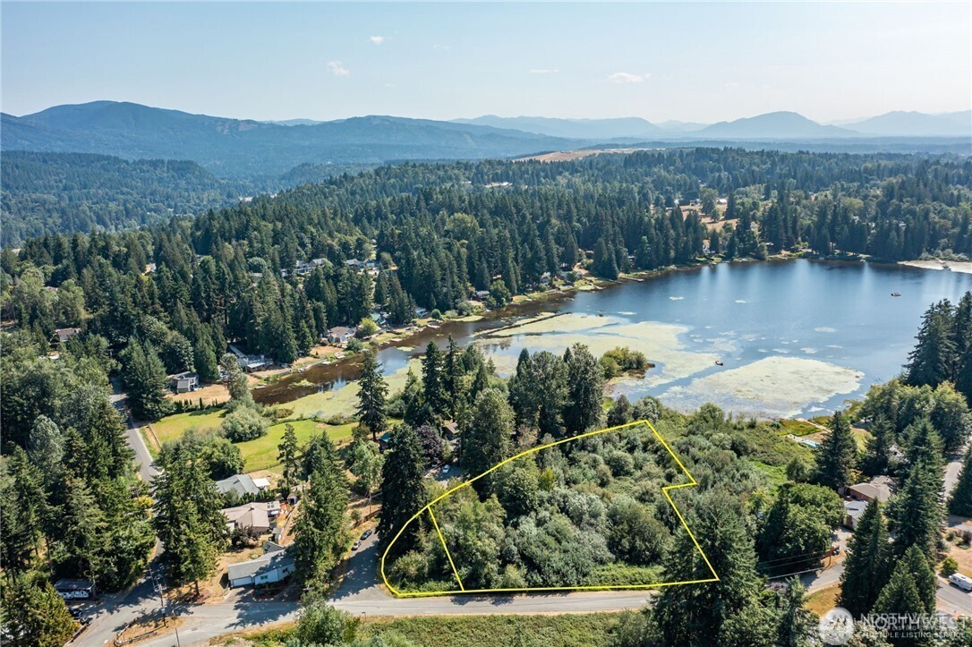 a view of a lake with mountains in the background