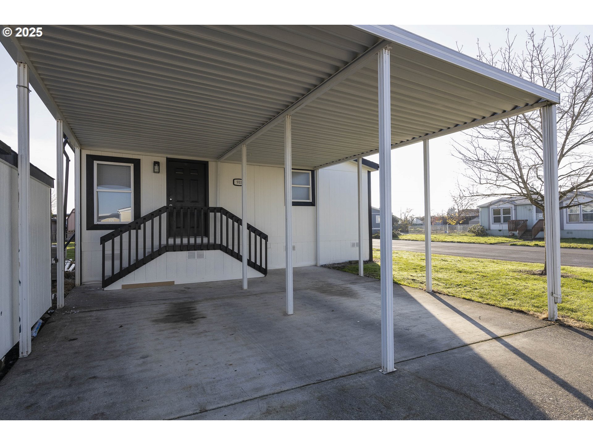 911 York Street, Unit 82 Aumsville, OR 97325 - Photo 20 of 26 a view of an house with backyard space and balcony