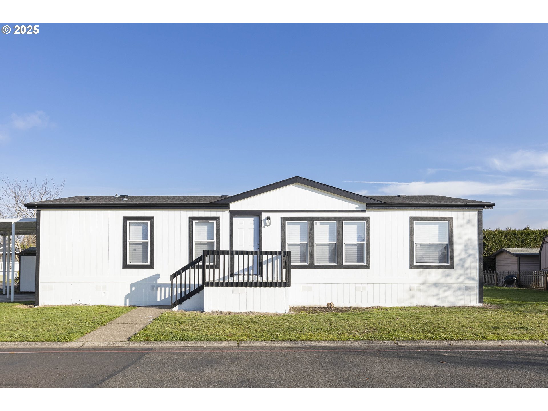 911 York Street, Unit 82 Aumsville, OR 97325 - Photo 2 of 26 a front view of a house with a yard