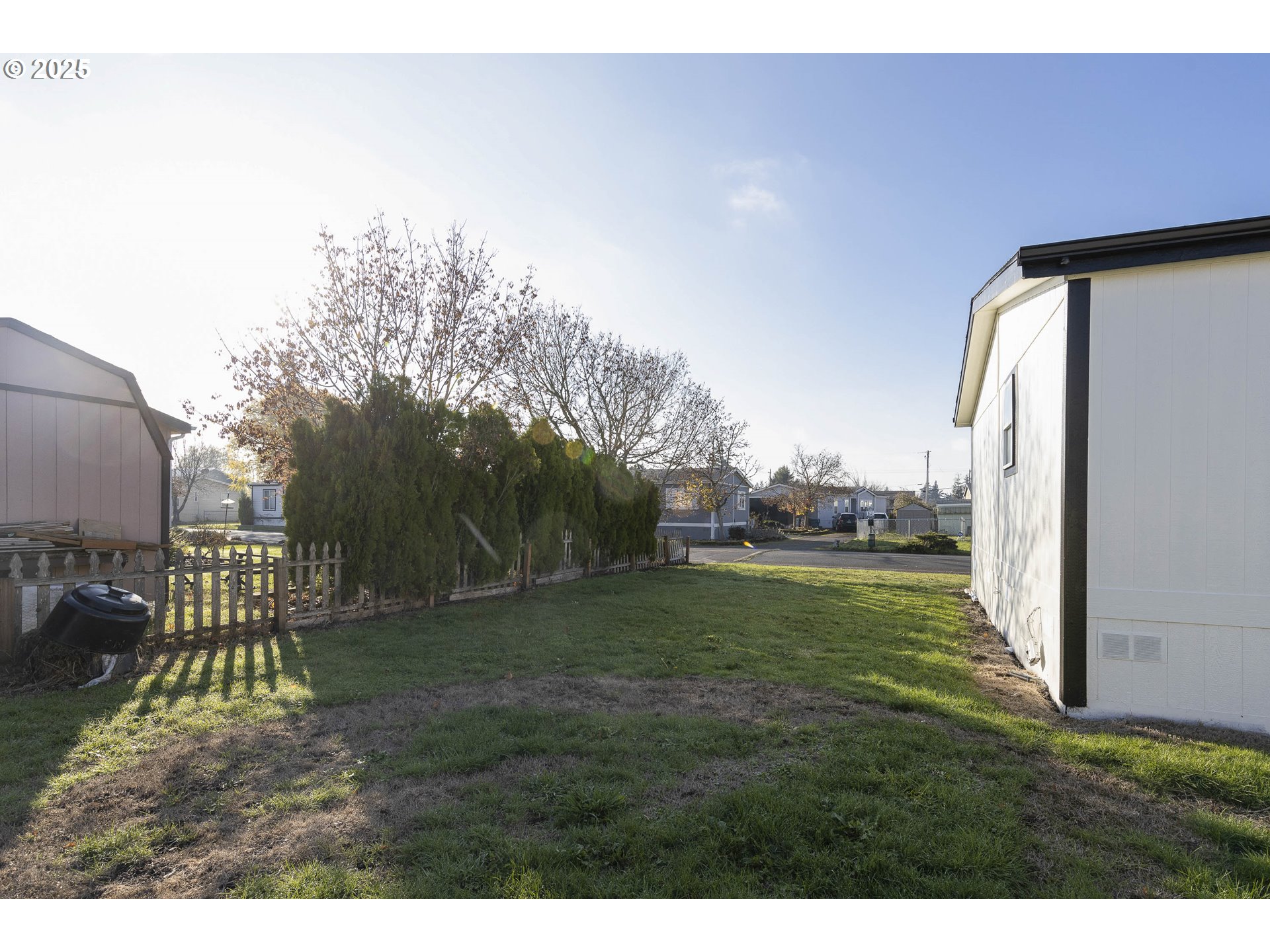 911 York Street, Unit 82 Aumsville, OR 97325 - Photo 22 of 26 a backyard of a house with lots of green space